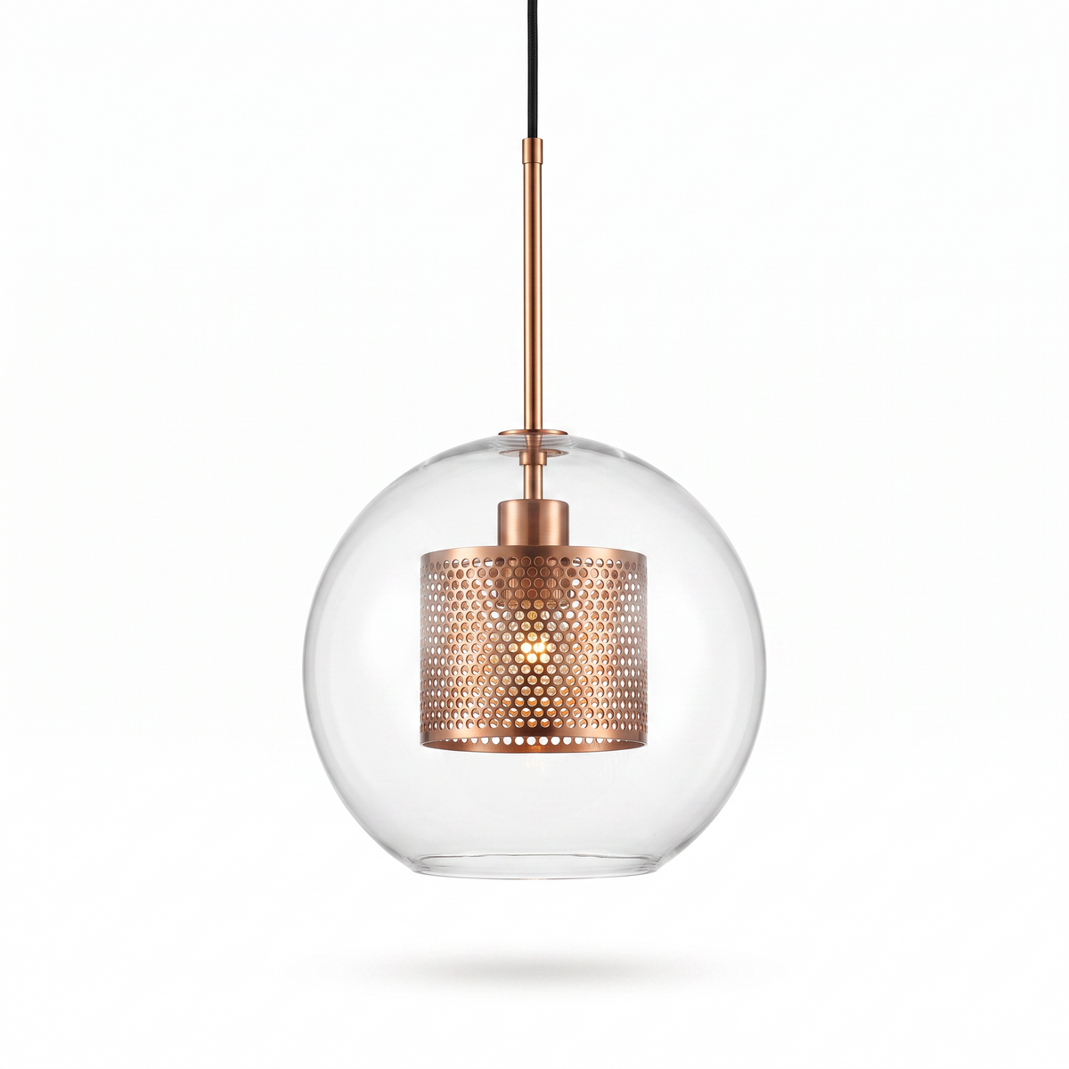 Comvilo Chiswick Glass Pendant Light: clear glass sphere with copper perforated inner drum, front studio view on white