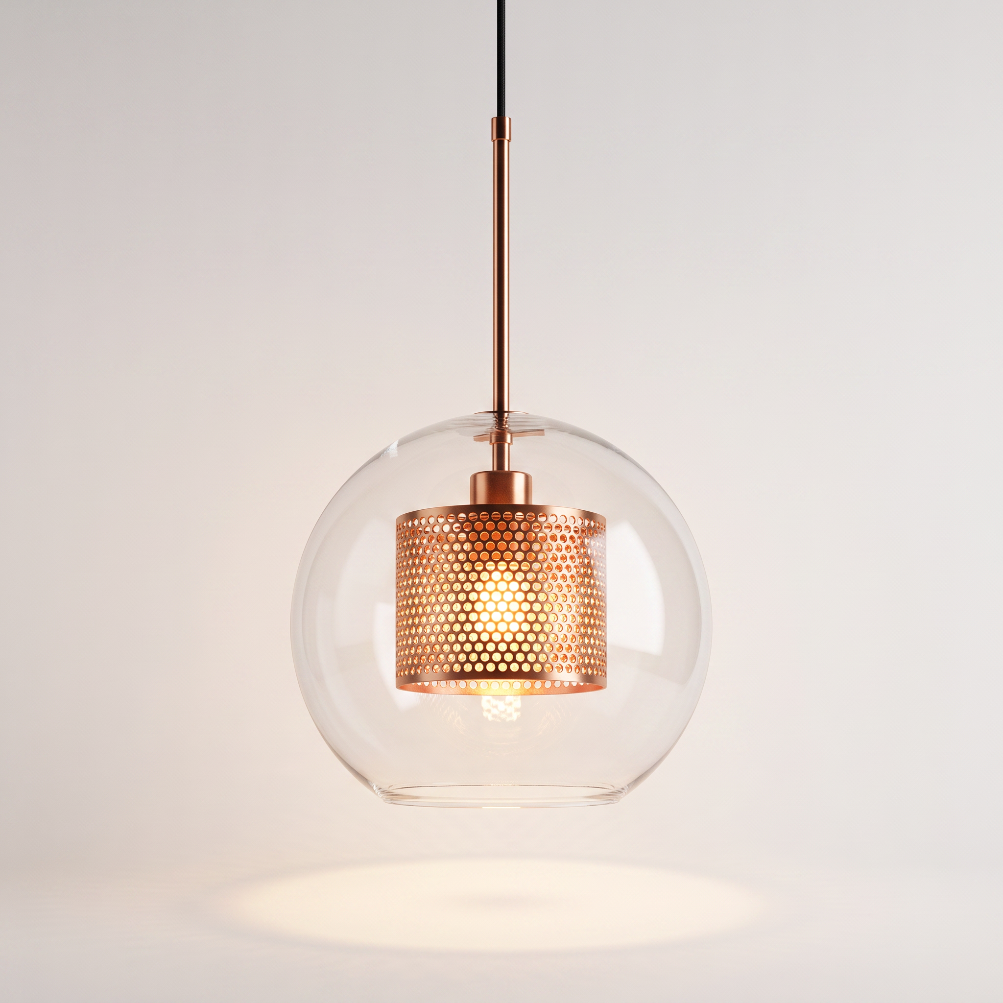 Comvilo Chiswick Glass Pendant Light illuminated, warm glow through the perforated copper drum