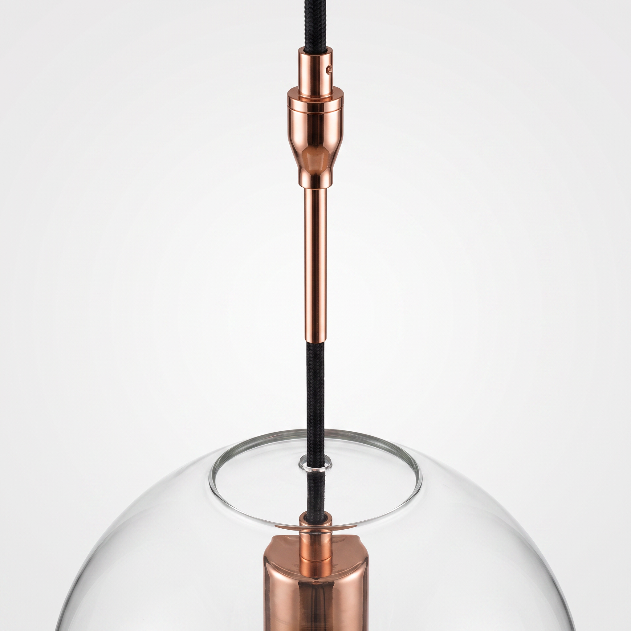 Detail of the copper suspension stem and cord connection above the glass sphere