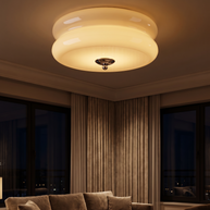 Marais ceiling light glowing warm in an evening living room