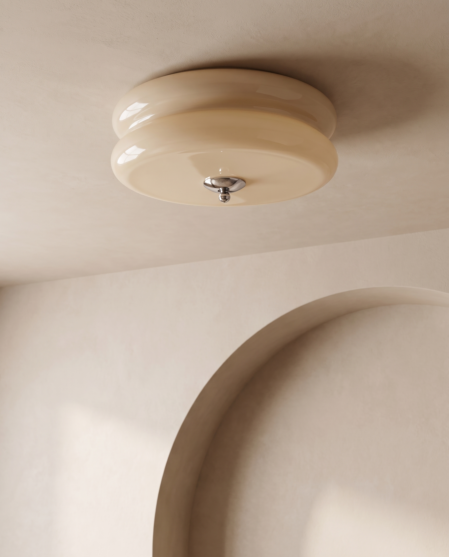 Low angle view of the Marais ceiling light near a plaster archway