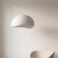 Nuvola cloud pendant as a sculptural object against a warm white plaster wall