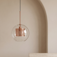 Chiswick Glass Pendant Light against a plaster arch with travertine plinth