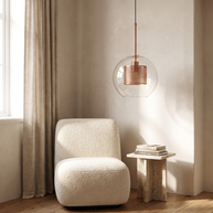 Chiswick Glass Pendant Light in a daylight reading corner with a boucle chair