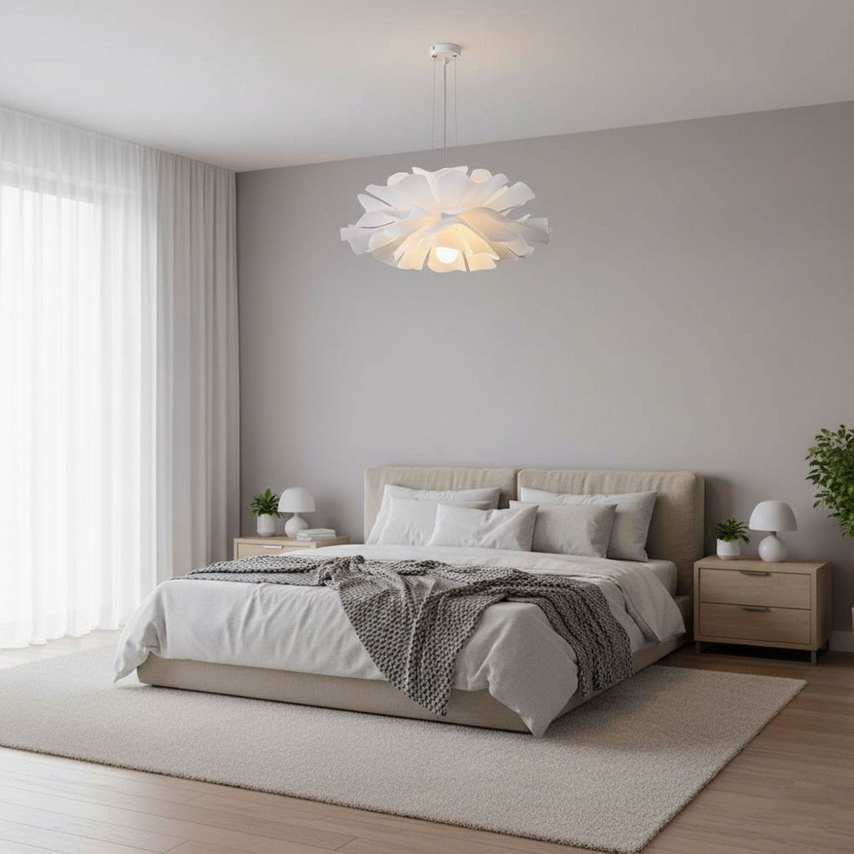 Lothaire Flower Pendant Light lit above a bed in a grey bedroom