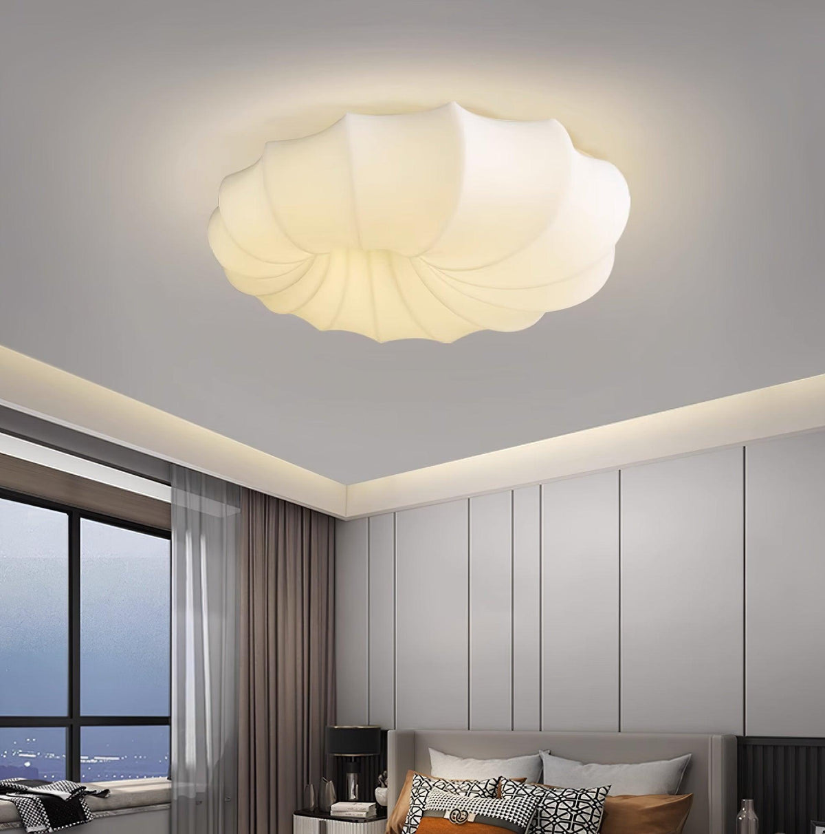Malvera Ceiling Light lit above a bedroom with a city view window