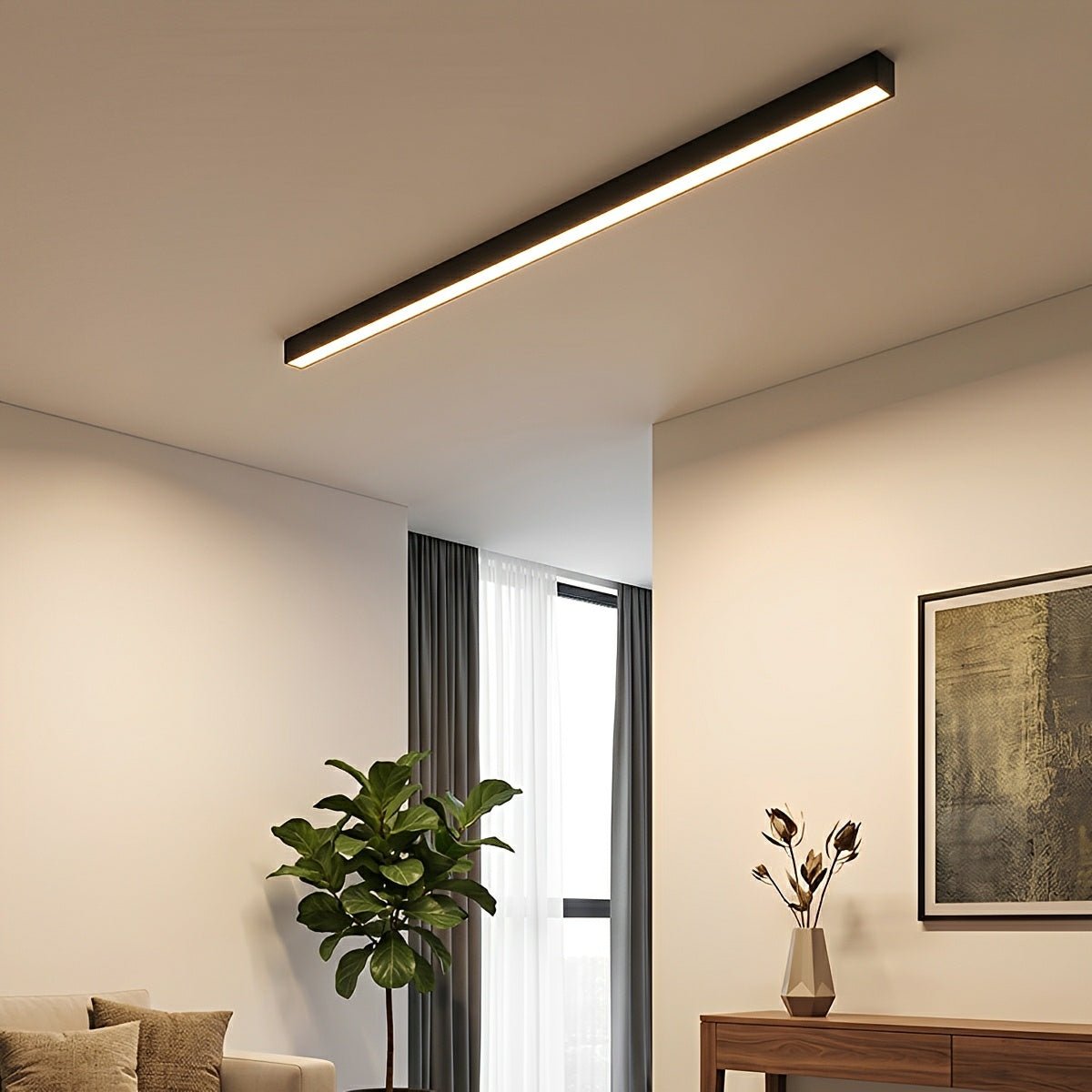Slim linear LED ceiling light with a black body, fitted across a ceiling near a window.