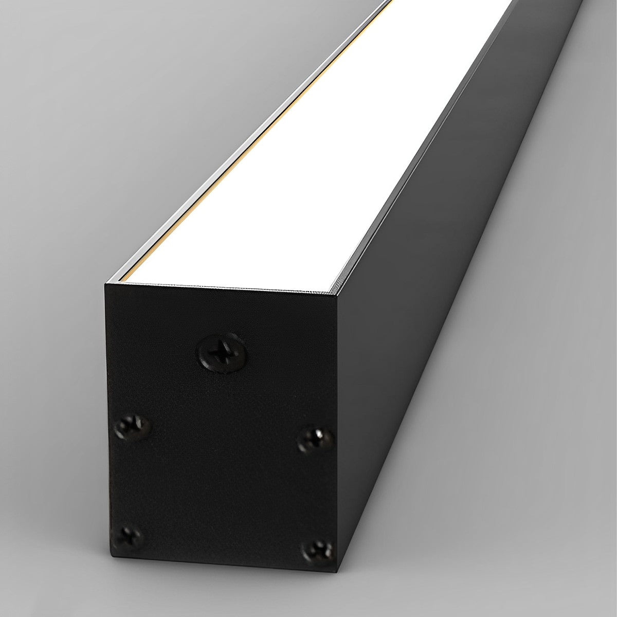 Close view of the black light at an angle, showing the housing end and the lit face.