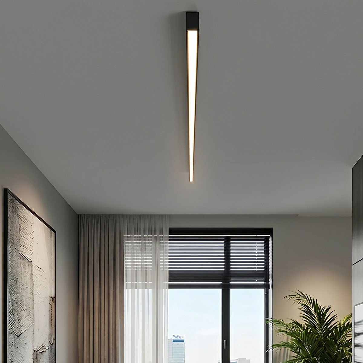 Slim linear ceiling light fitted across a grey bedroom ceiling beside a window.