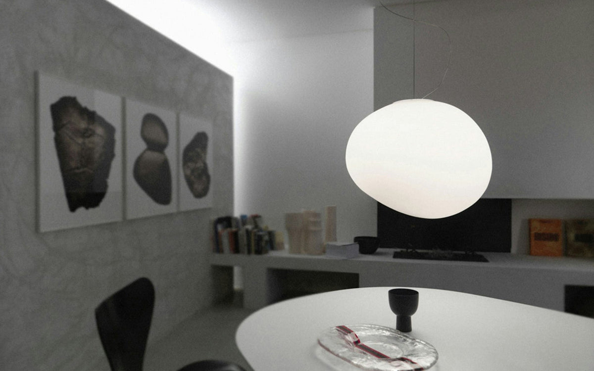 Pebbrine Stone-Shape Glass Pendant Light, single lit pendant over white dining table, grey room