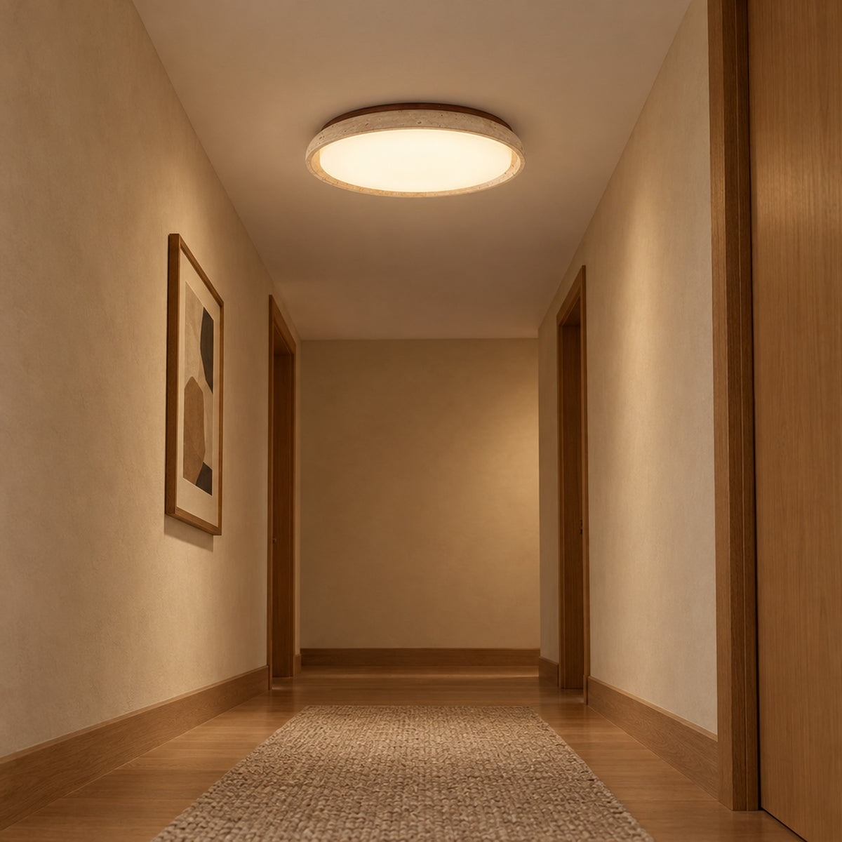 Pietra Walnut Travertine Ceiling Light, lit on the ceiling of a warm hallway