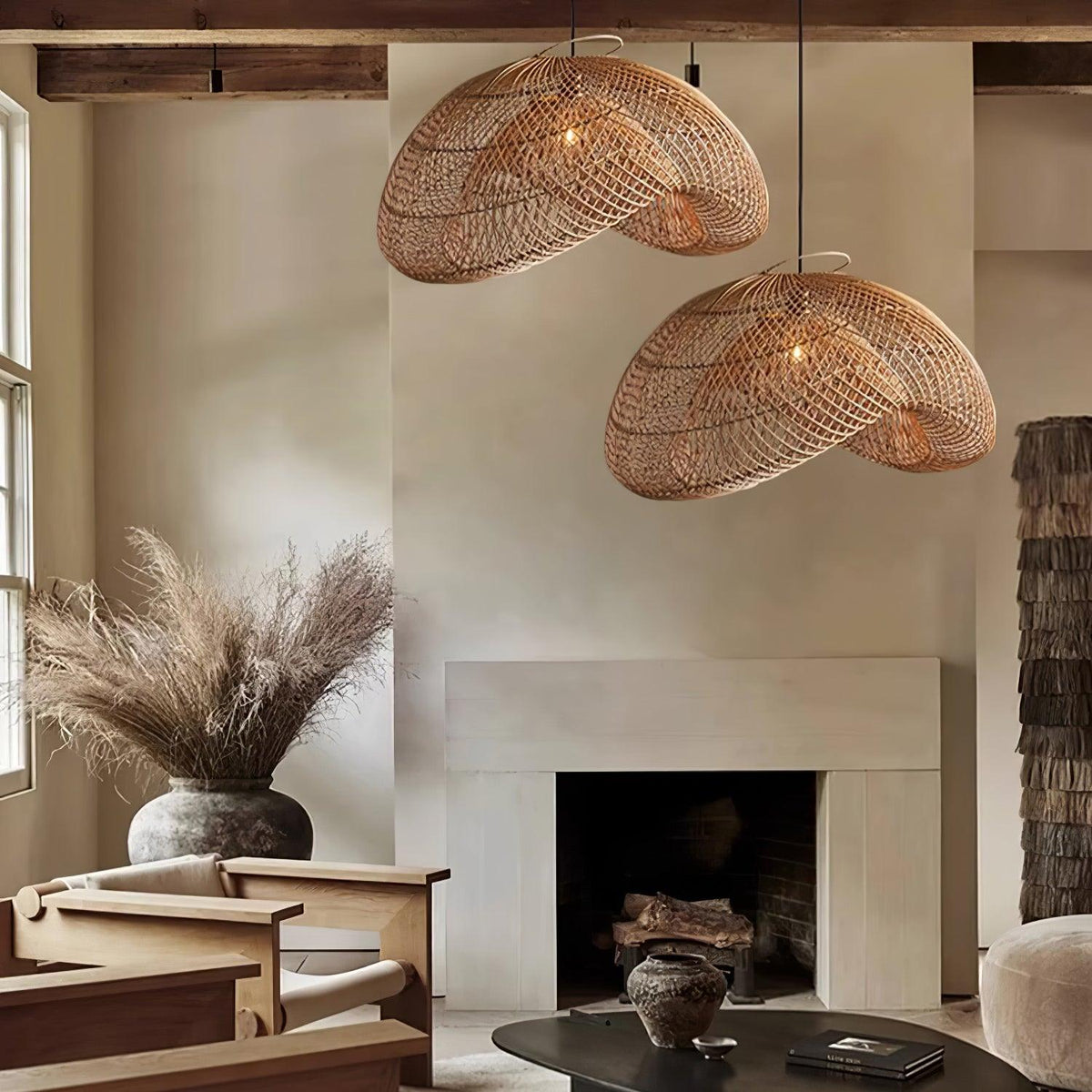 Revalle Wave Pendant Light, two natural rattan shades lit above a living room with a fireplace
