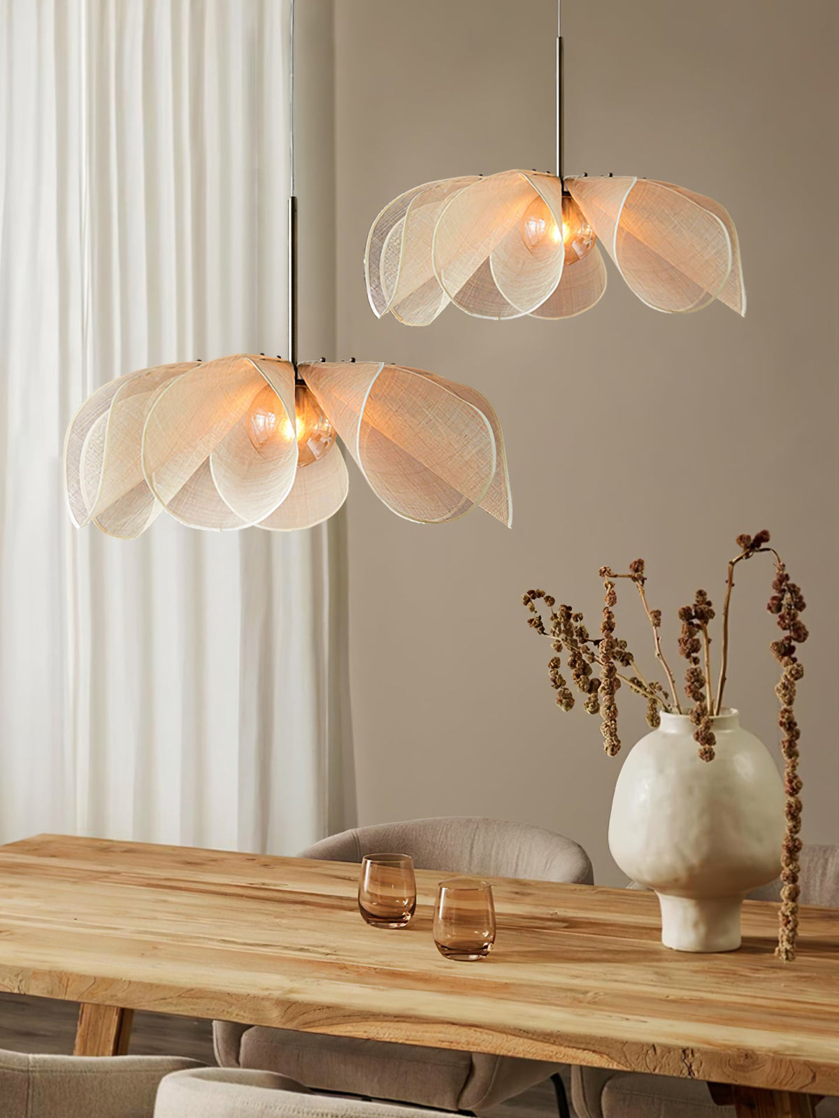 Seradina Loom Pendant Light, two beige pendants lit above a wooden dining table