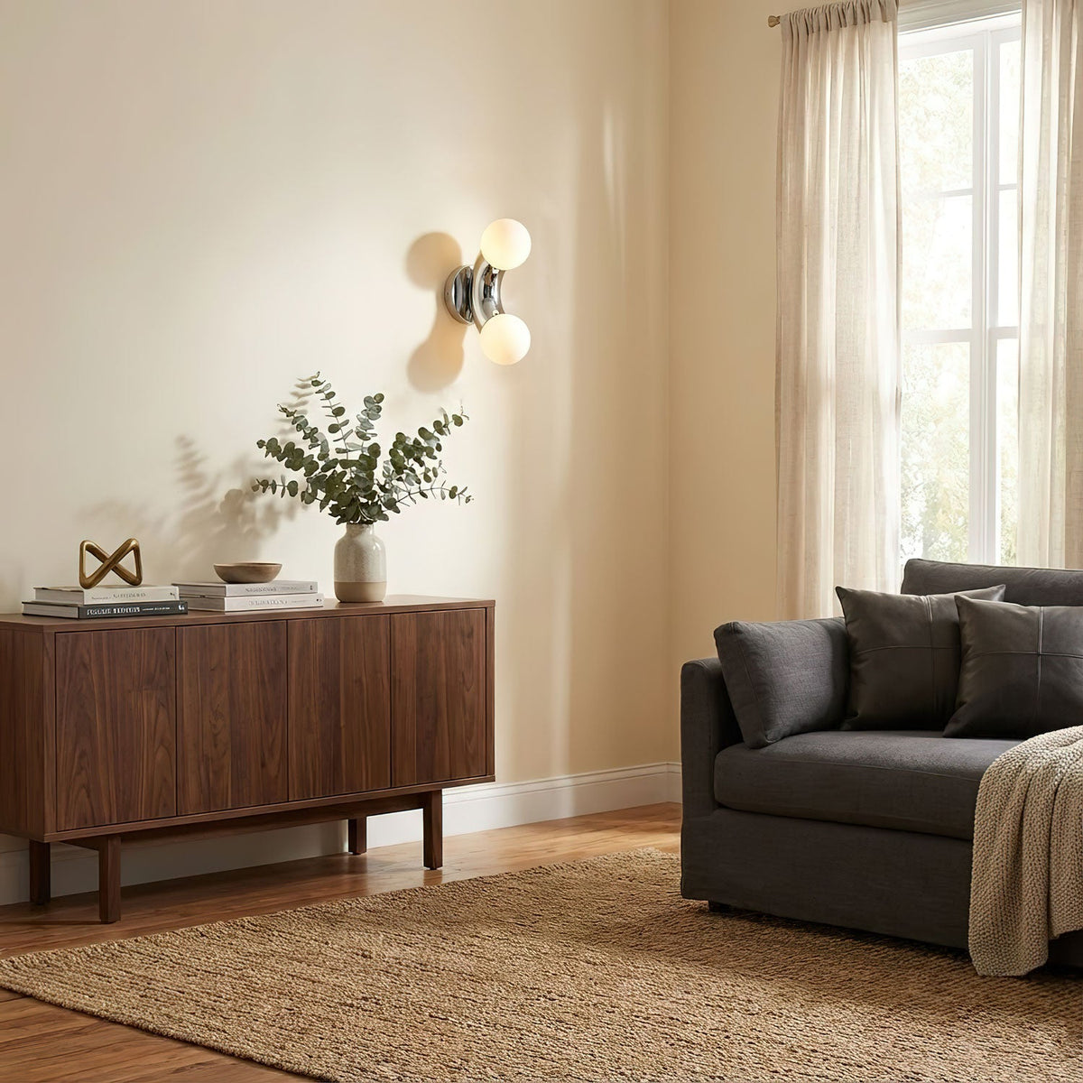 Virelle Wall Light on a living room wall above a walnut sideboard