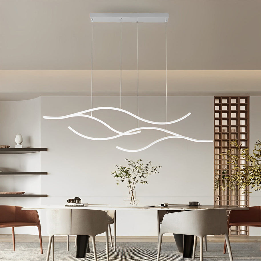 Linear pendant light made of wavy chrome-coloured LED bars hung from a slim rectangular canopy above a long dining table.