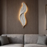 Feather White Resin LED Wall Light in white, lit on a slatted wood wall