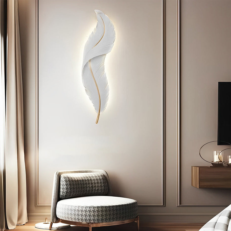 Feather White Resin LED Wall Light in white, above a seating area