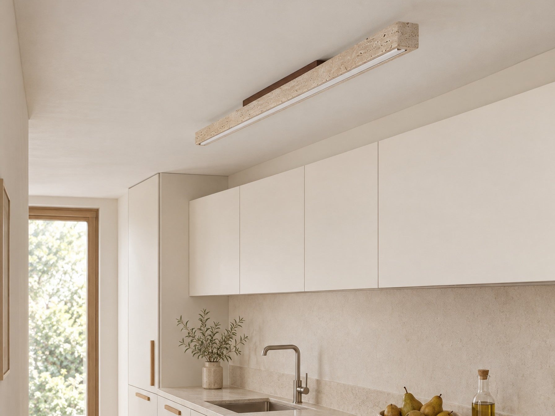 Travellin Ceiling Light, travertine bar with dark walnut mount on a daylit galley kitchen ceiling